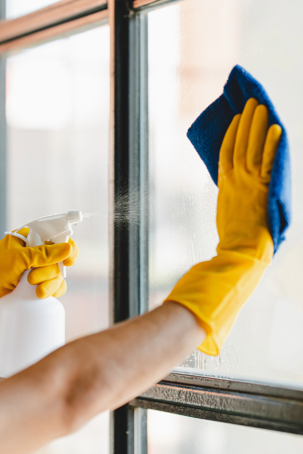 Window Cleaning Professional cleaner cleaning windows in a home